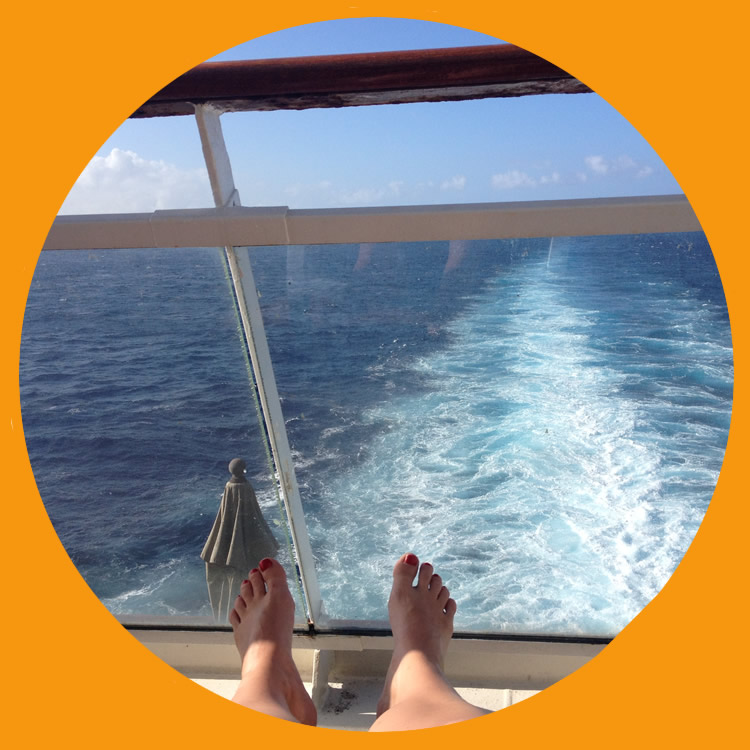 view from the back of a cruise ship looking at the wake