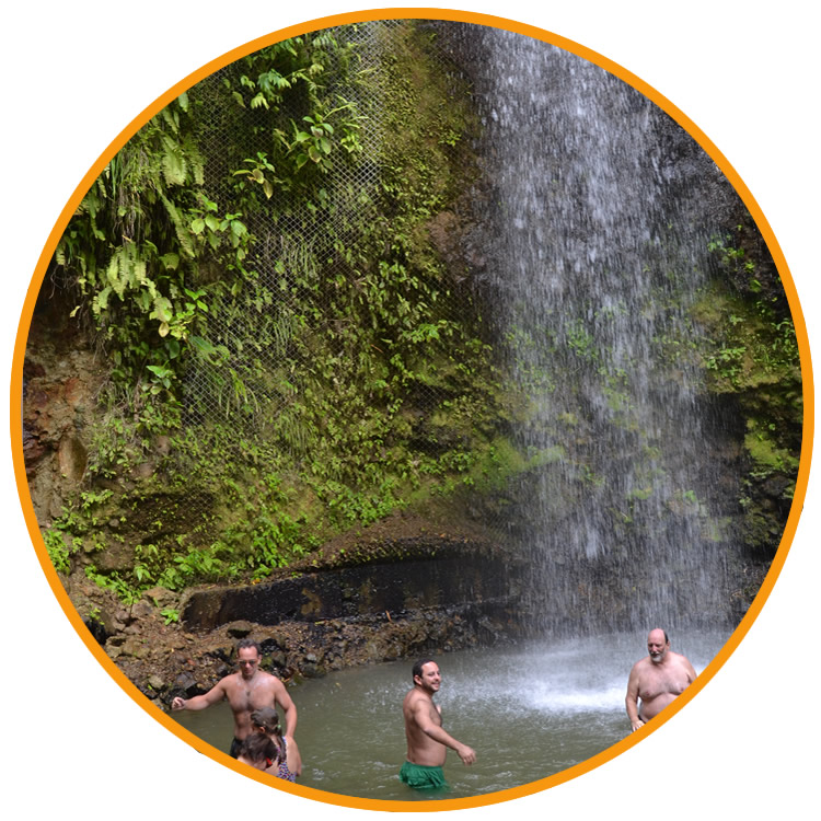 People from the group going for a dip at the waterfall