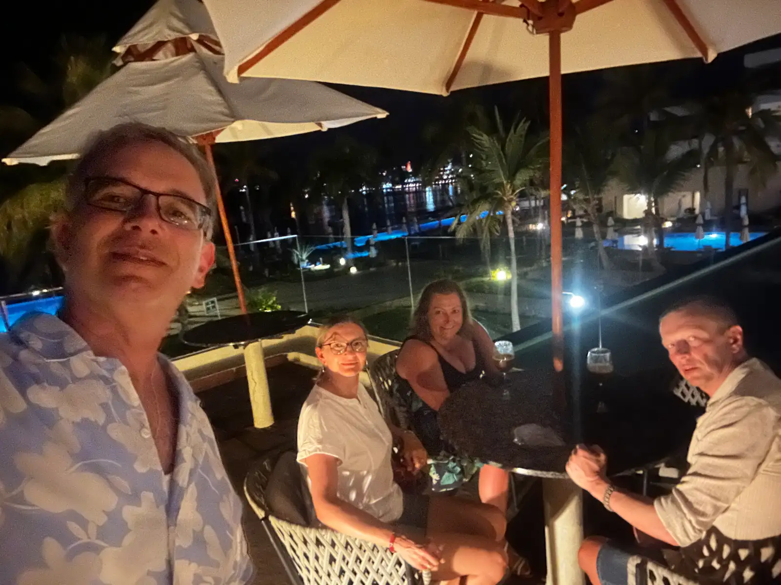 Through my shades — a card game with new friends at the rooftop smoking section
