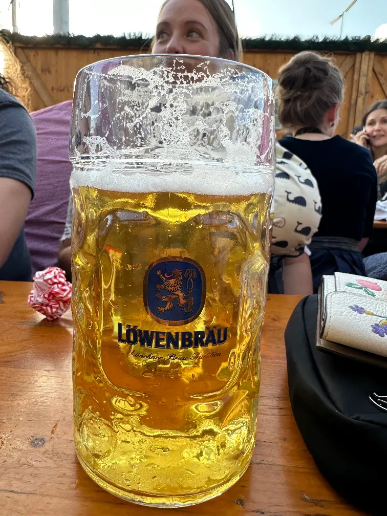 A server at Oktoberfest delivered a, one-litre Maß steins of beer